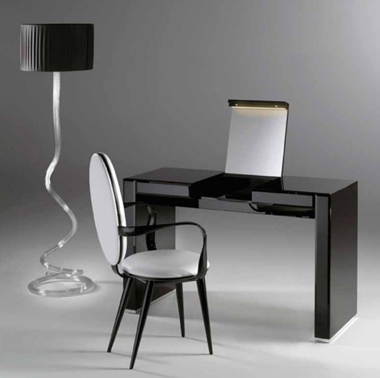 Desk with designer Italian lamp next to it