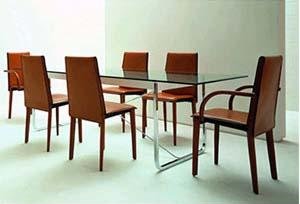 Italian dining table surrounded by leather chairs