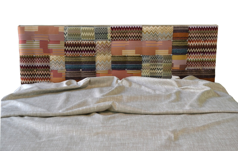 Italian bed with fabric patterned backboard