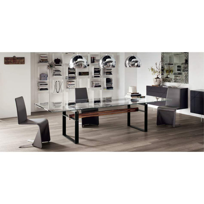 dining room full of Italian furniture and glass top table by Cattelan Italia