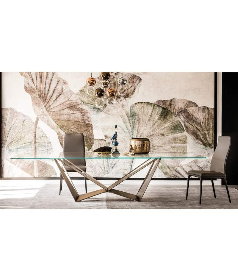 Italian dining room with Skorpio glass top table made in Italy by Cattelan Italia