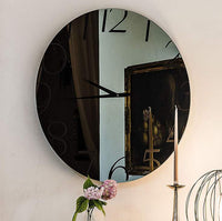 Glass clock with modern styling by Cattelan Italia