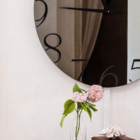 round mirrored clock made in Italy by Cattelan Italia