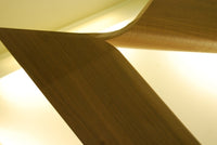 Close view of sculpted wooden base of Italian coffee table