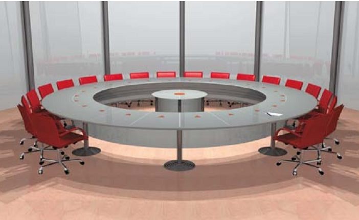 Large round luxury conference table surrounded by red chairs