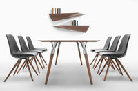 Dining table surrounded by chairs made in Italy by Tonon