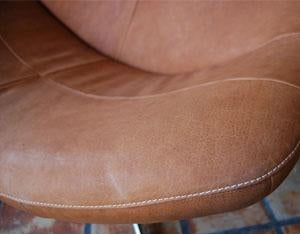 close view of the Gigi Chair's leather and stitching