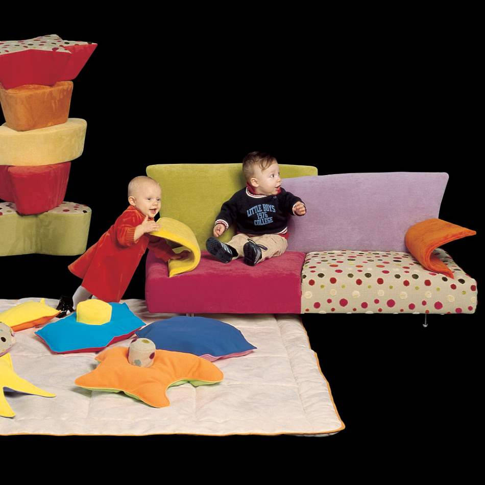 Italian children sitting on kid's couch