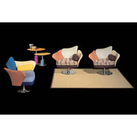 Staged room full of Italian furniture with black backdrop