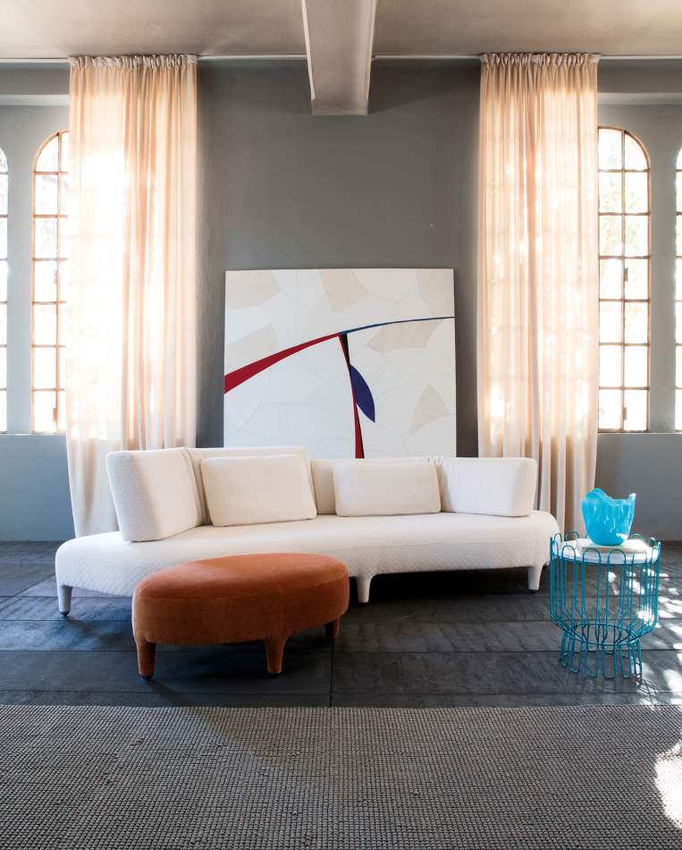 Il Loft sofa with paining behind it