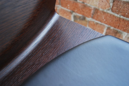 close view of bar stool leather and wood grain