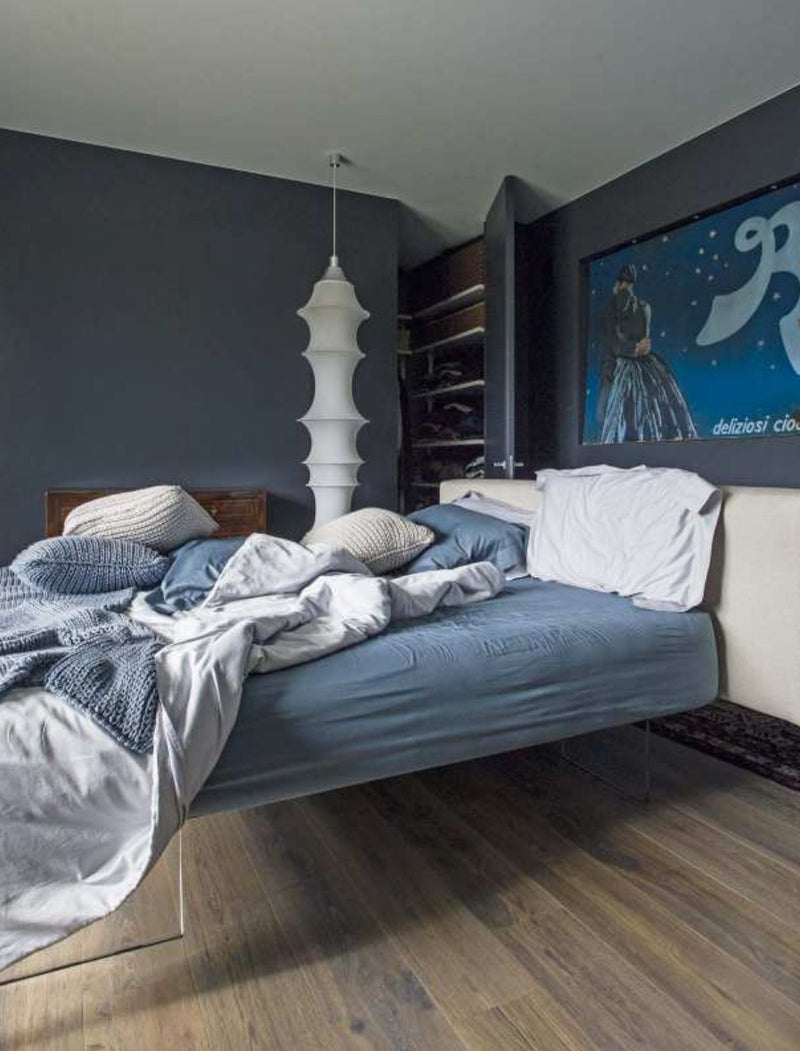 Italian bedroom with blue tones throughout the room