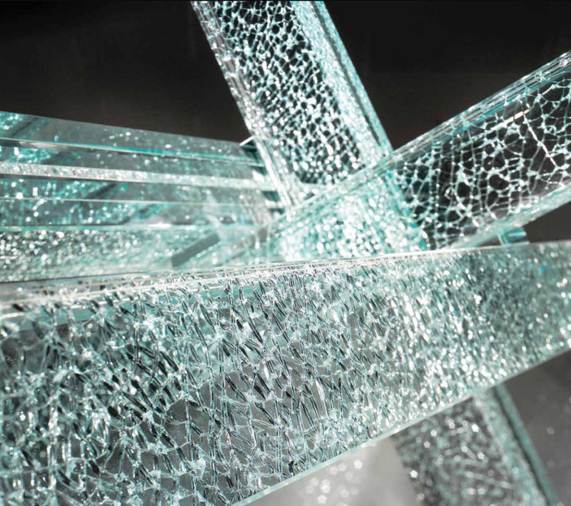 Close view of glass star base of Italian Transeo 72 Craquele Table