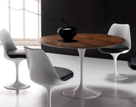 Eero Saarinen Dining Table surrounded by chairs