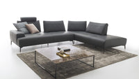 Room with black Italian sofa and coffee table