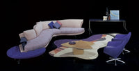 Super Roy Esc Sofa by Il Loft in a dark room with purple carpet